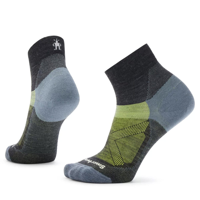Load image into Gallery viewer, A pair of Smartwool women&#39;s bike zero cushion ankle socks in gray, green, and blue colors.
