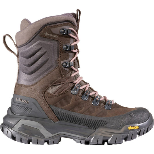 Brown and gray hiking boot with visible brand logos on a white background