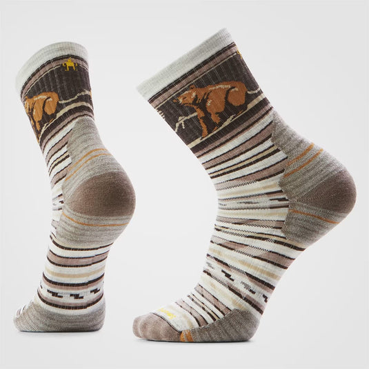 Pair of striped socks with bear design on a light gray background