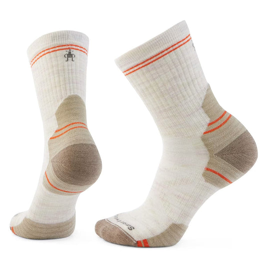 Pair of white socks with brown and orange accents on a white background