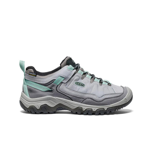 Gray hiking shoe with teal accents on a white background