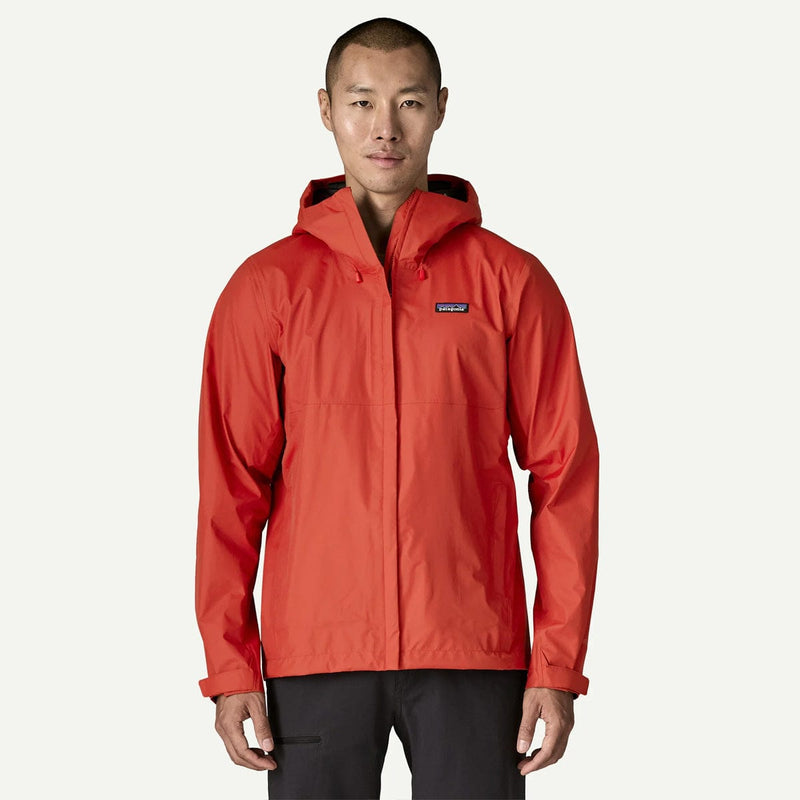 Load image into Gallery viewer, Person wearing a red rain jacket with a visible brand logo on a white background
