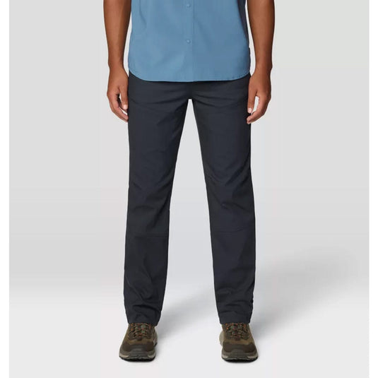 Person wearing a blue shirt and black pants on a white background