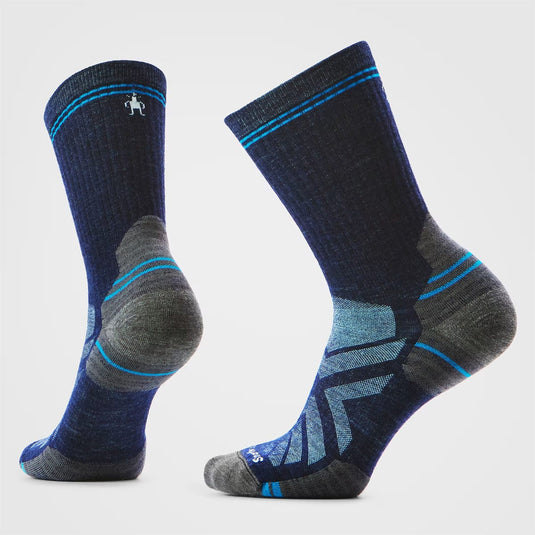 Pair of blue and gray socks with a subtle pattern on a light gray background