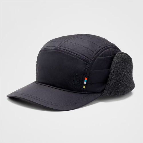 Black winter cap with earflaps on a light gray background