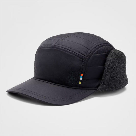 Black winter cap with earflaps on a light gray background