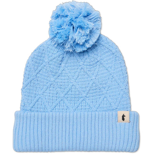 Light blue knit beanie with pom-pom on a white background