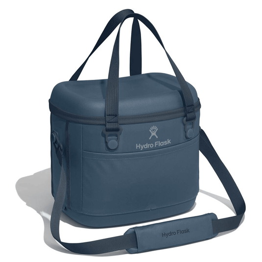 Blue cooler bag with shoulder strap on a white background, featuring Hydro Flask logo.
