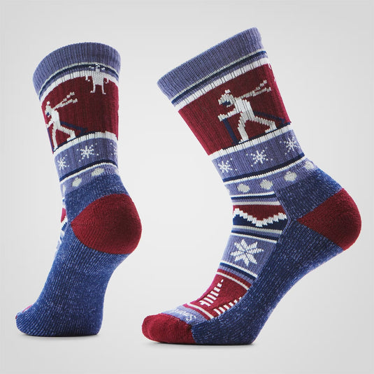 Pair of blue and red patterned socks on a light gray background
