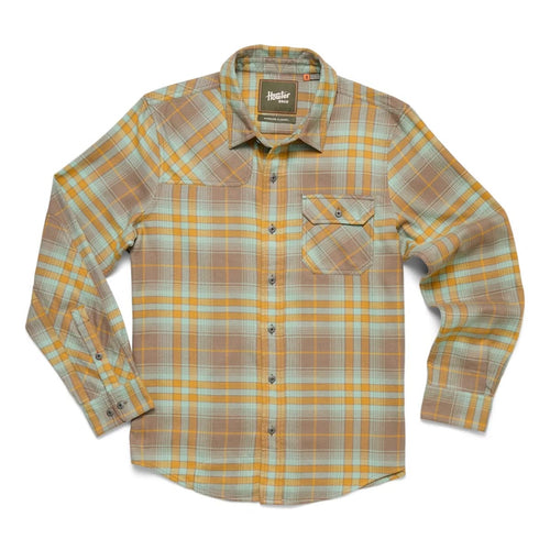 Plaid shirt with a visible brand label on a white background