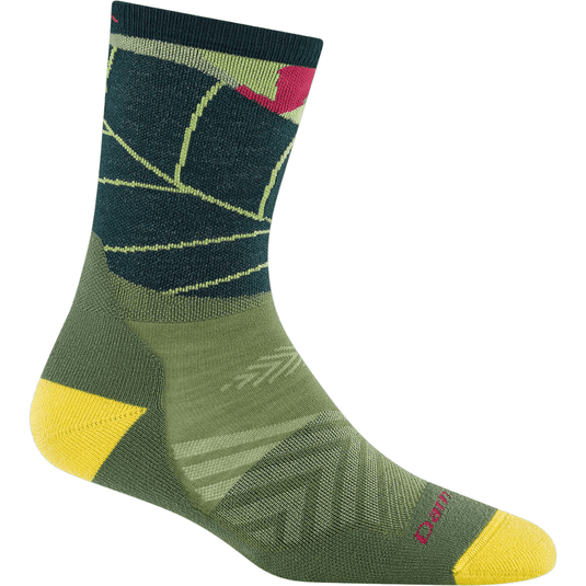 Green and yellow sock with a pattern on a white background