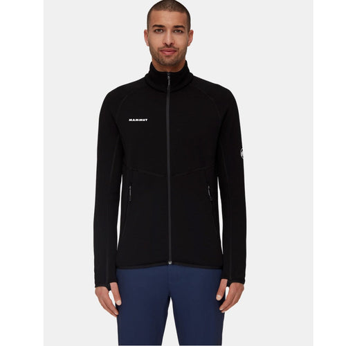 Man wearing a black jacket with a visible brand logo on a white background