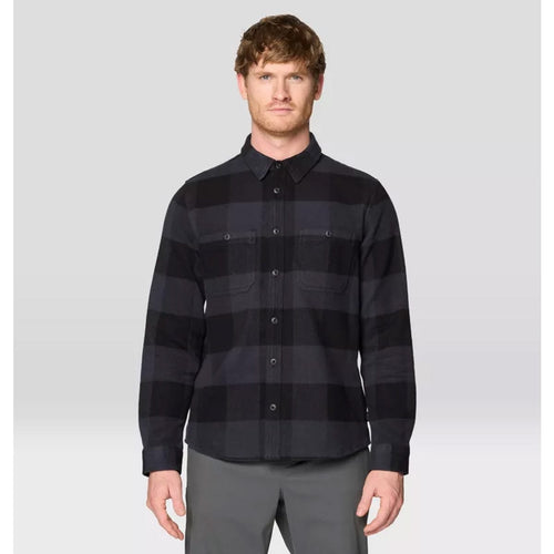 Man wearing a black and gray striped shirt against a white background