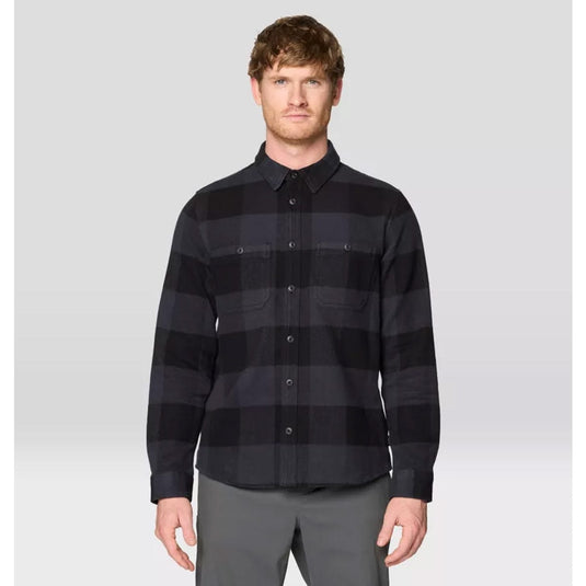 Man wearing a black and gray striped shirt against a white background