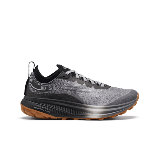 Gray and black running shoe with brown sole on a white background