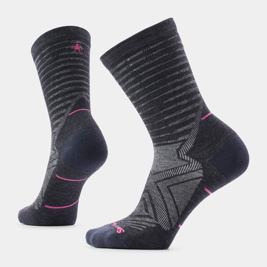 Pair of gray socks with pink accents on a light gray background