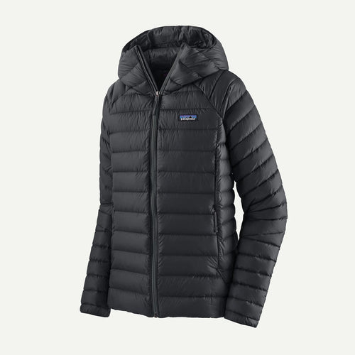 Black puffer jacket with a brand logo on a light gray background