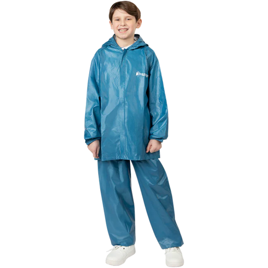 Child wearing a blue raincoat and pants set on a white background