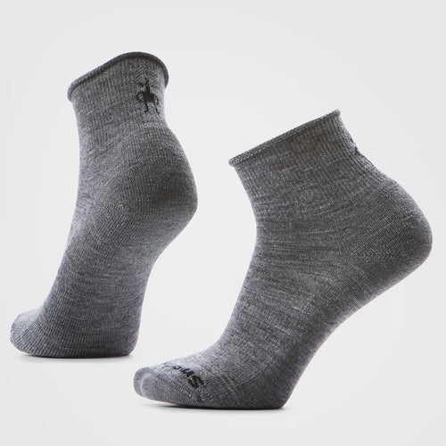 Pair of gray ankle socks on a light gray background