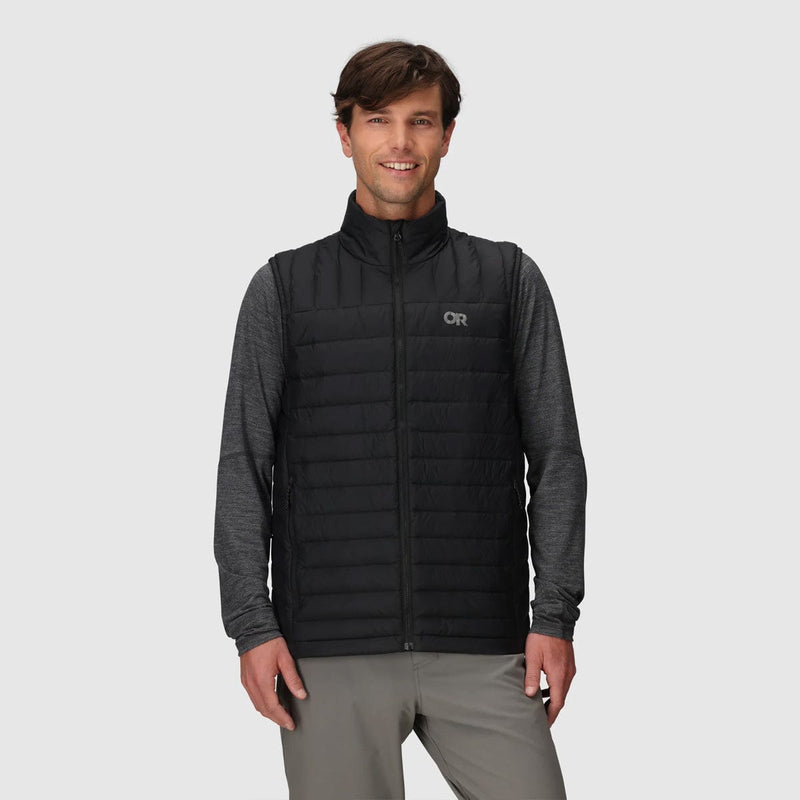 Load image into Gallery viewer, Man wearing a black and gray quilted vest with a logo on a light gray background
