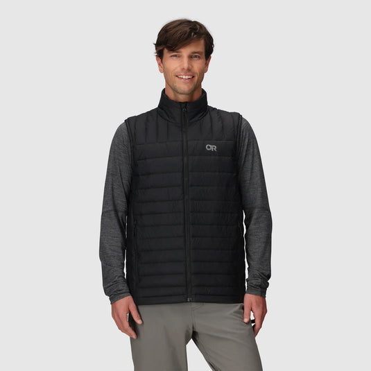 Man wearing a black and gray quilted vest with a logo on a light gray background