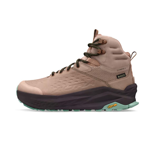 Beige hiking boot with black sole on a white background