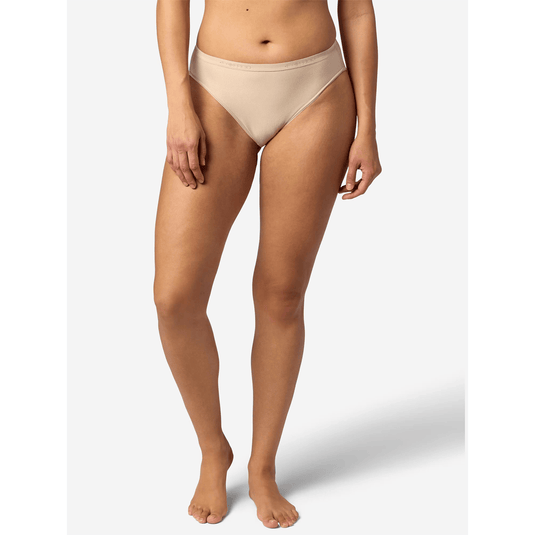 Beige bikini bottom worn by a person on a white background