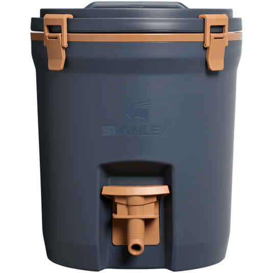 Blue cooler with brown handles and a visible Stanley logo on a white background