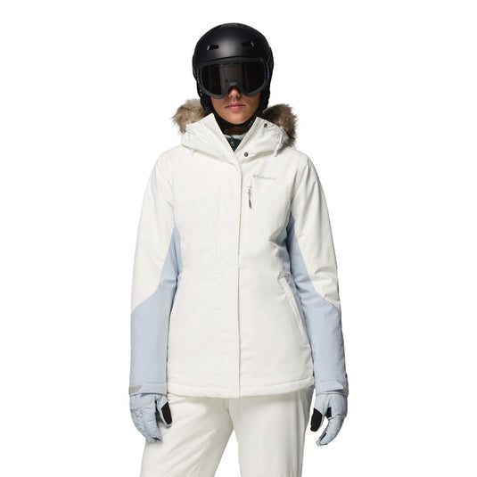 Person wearing a white ski jacket with gray sleeves, black helmet, and goggles on a white background