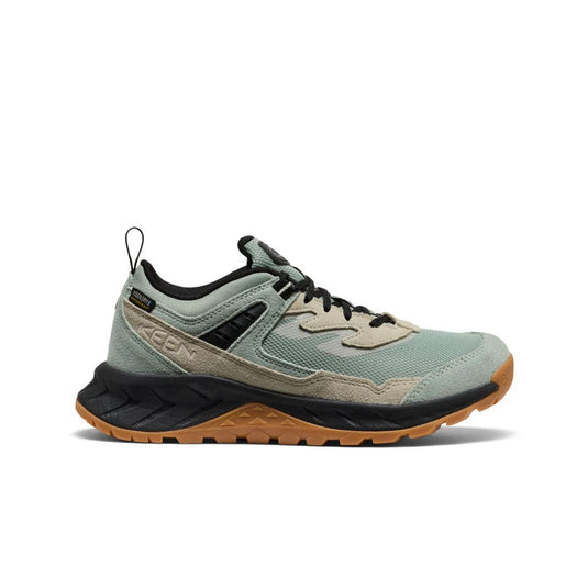 Light blue hiking shoe with brown sole on a white background