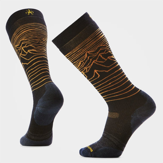 Black socks with gold patterns on a light gray background
