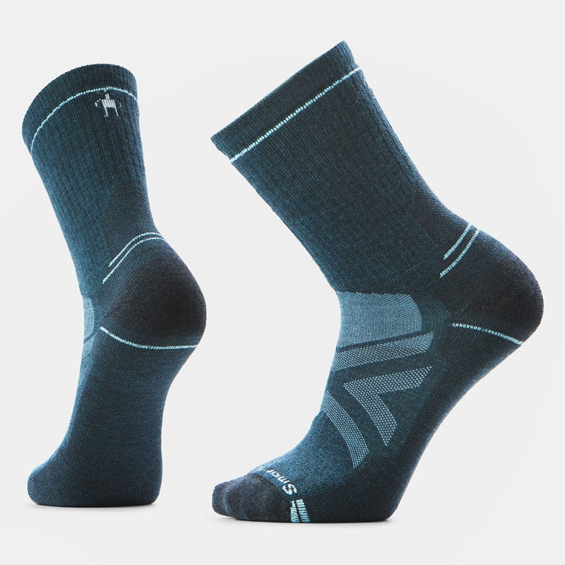 Load image into Gallery viewer, Pair of blue socks with a visible brand logo on a light gray background
