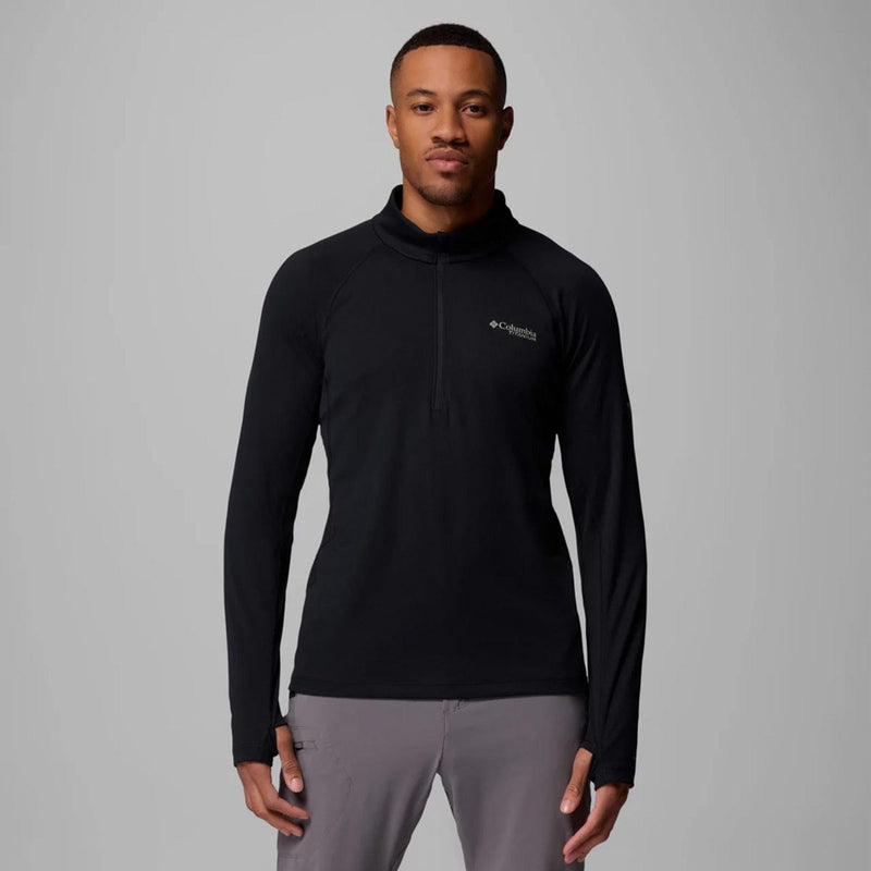 Load image into Gallery viewer, Man wearing a black long-sleeve shirt with a logo on a gray background
