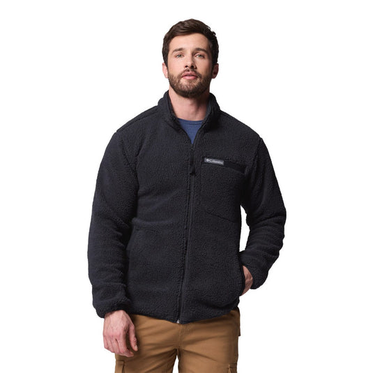 Man wearing a black fleece jacket on a white background