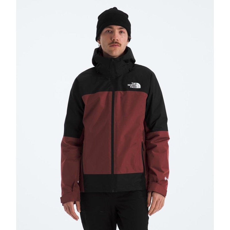 Load image into Gallery viewer, Person wearing a black and red jacket with a brand logo on a white background
