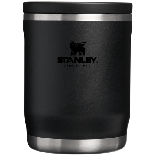 Black Stanley insulated mug with silver lid on a white background