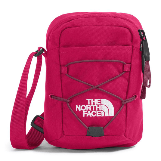 Pink crossbody bag with The North Face logo on a white background