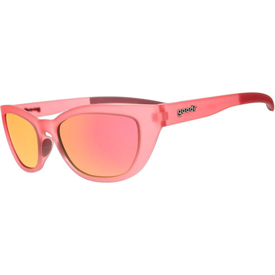 Pink sunglasses with yellow lenses on a white background