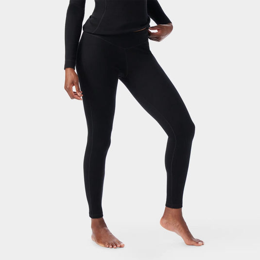 Person wearing black leggings on a white background