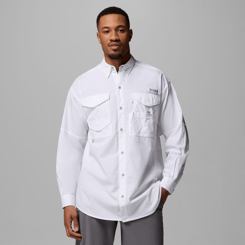 Load image into Gallery viewer, Man wearing a white shirt with pockets on a gray background
