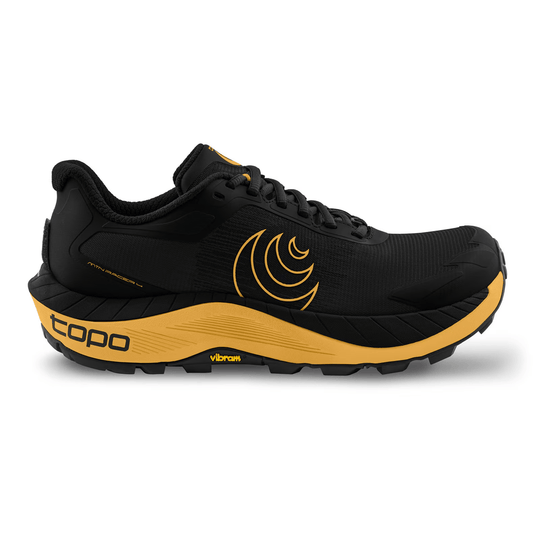 Black and yellow running shoe with Topo brand logo on a white background