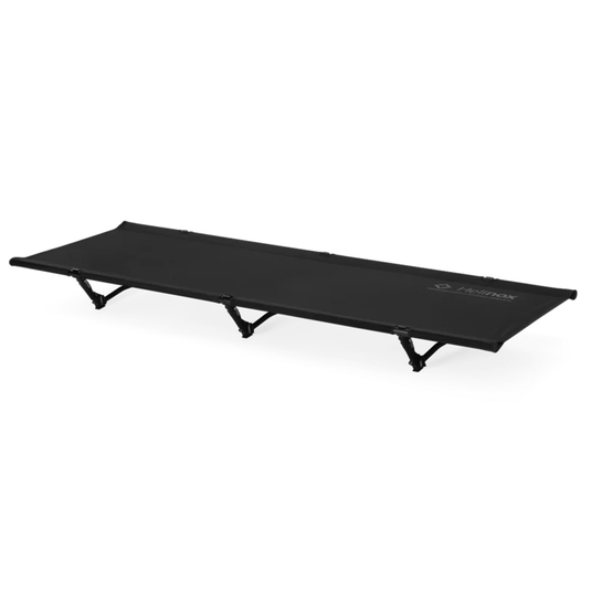 Black folding cot on a white background