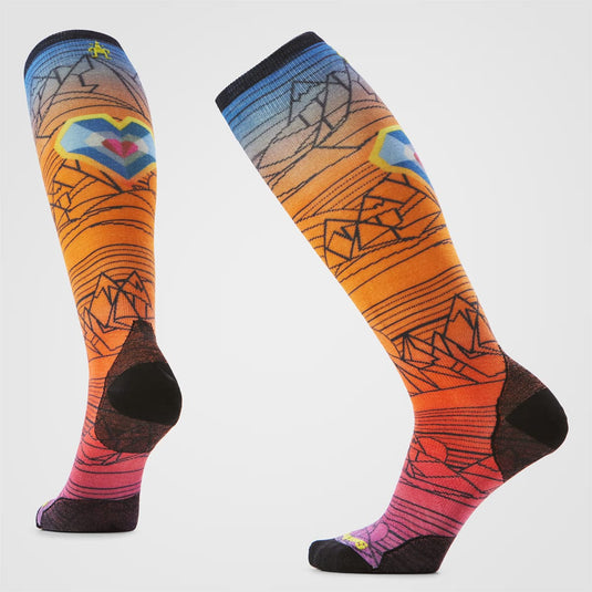 Colorful knee-high socks with abstract designs on a white background