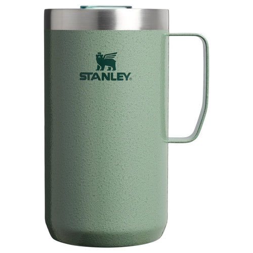 Green Stanley mug with a handle on a white background