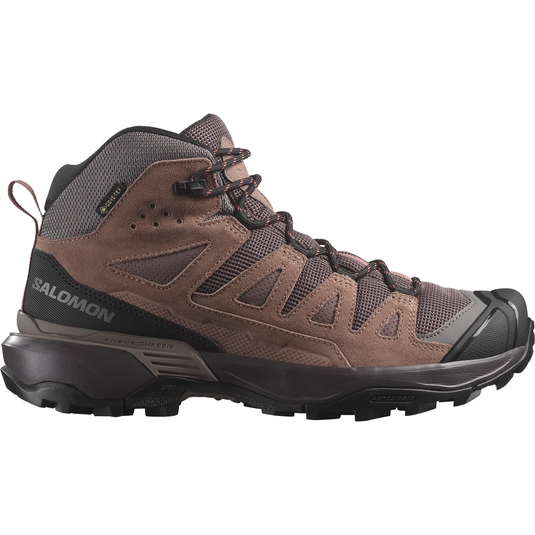 Brown hiking boot with black sole on a white background