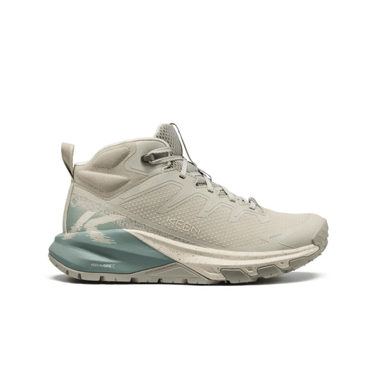 Beige and green hiking shoe on a white background