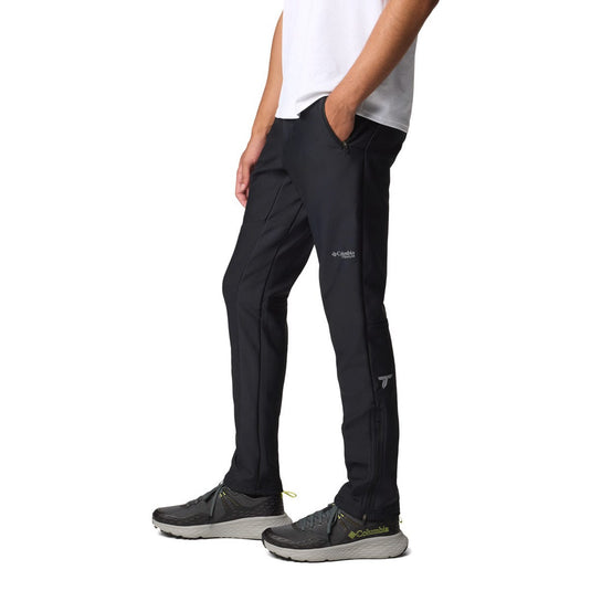 Person wearing black pants with a visible brand logo on a white background