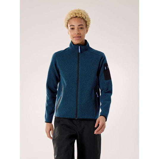 Person wearing a blue jacket with a white background