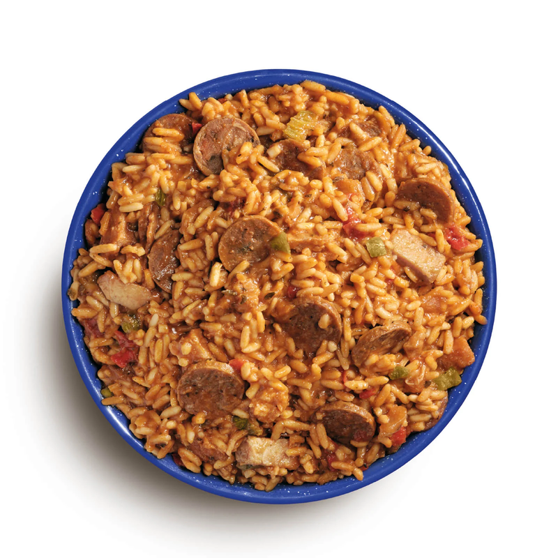 Load image into Gallery viewer, Bowl of jambalaya with sausage and vegetables on a white background
