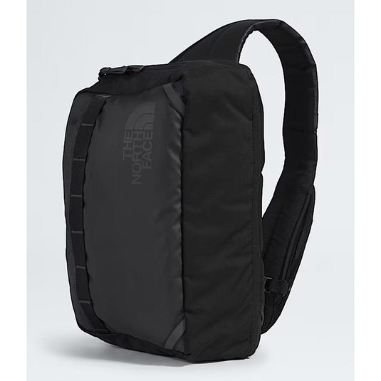 Black sling bag with The North Face logo on a light gray background